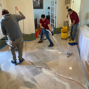 Technicians polishing a marble foyer